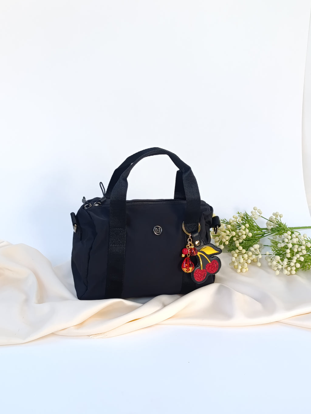 Minibag impermeable con Charm Cherry